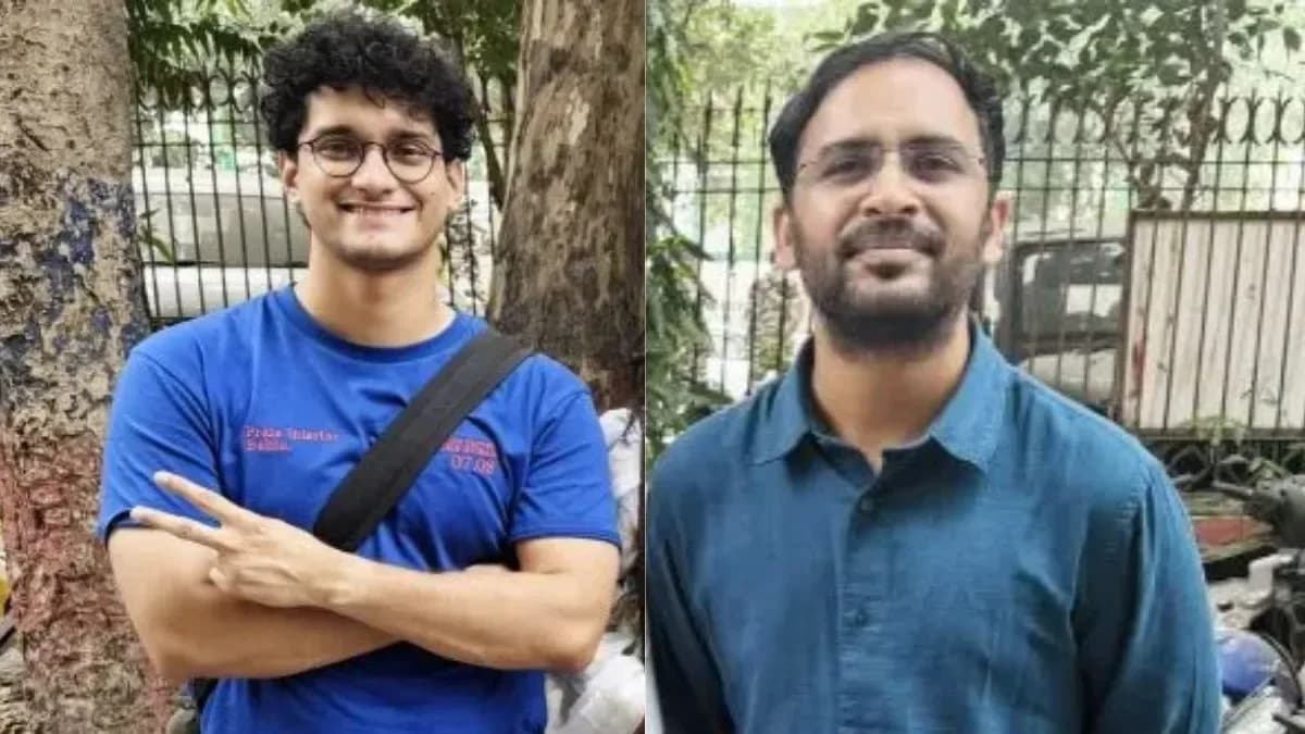 दो आदमी बाहर खड़े हैं, एक नीली टी-शर्ट और दूसरा नीली शर्ट पहने हुए।